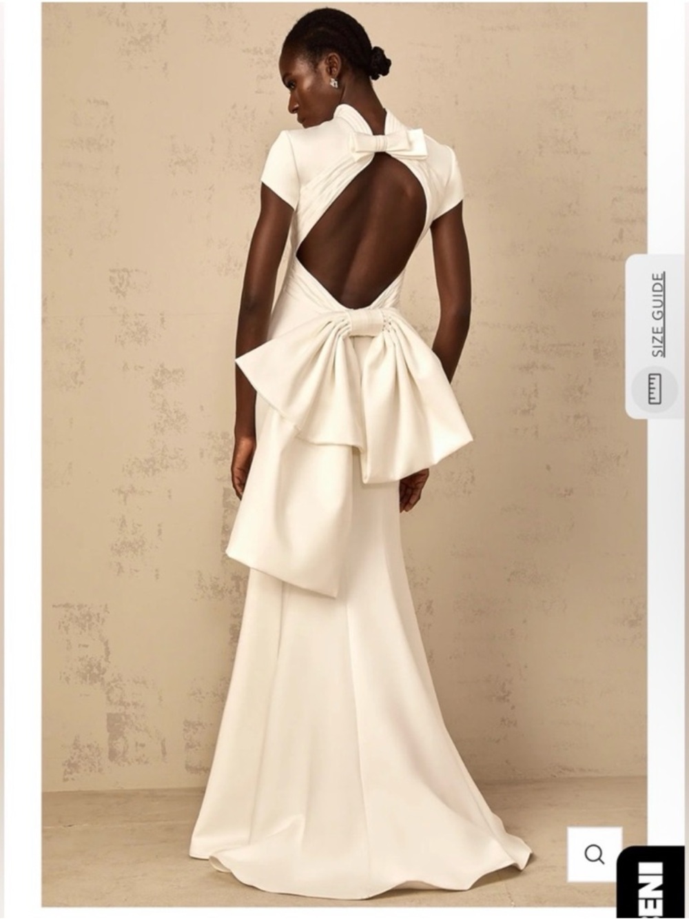 Elegant White open back gown with bow statement